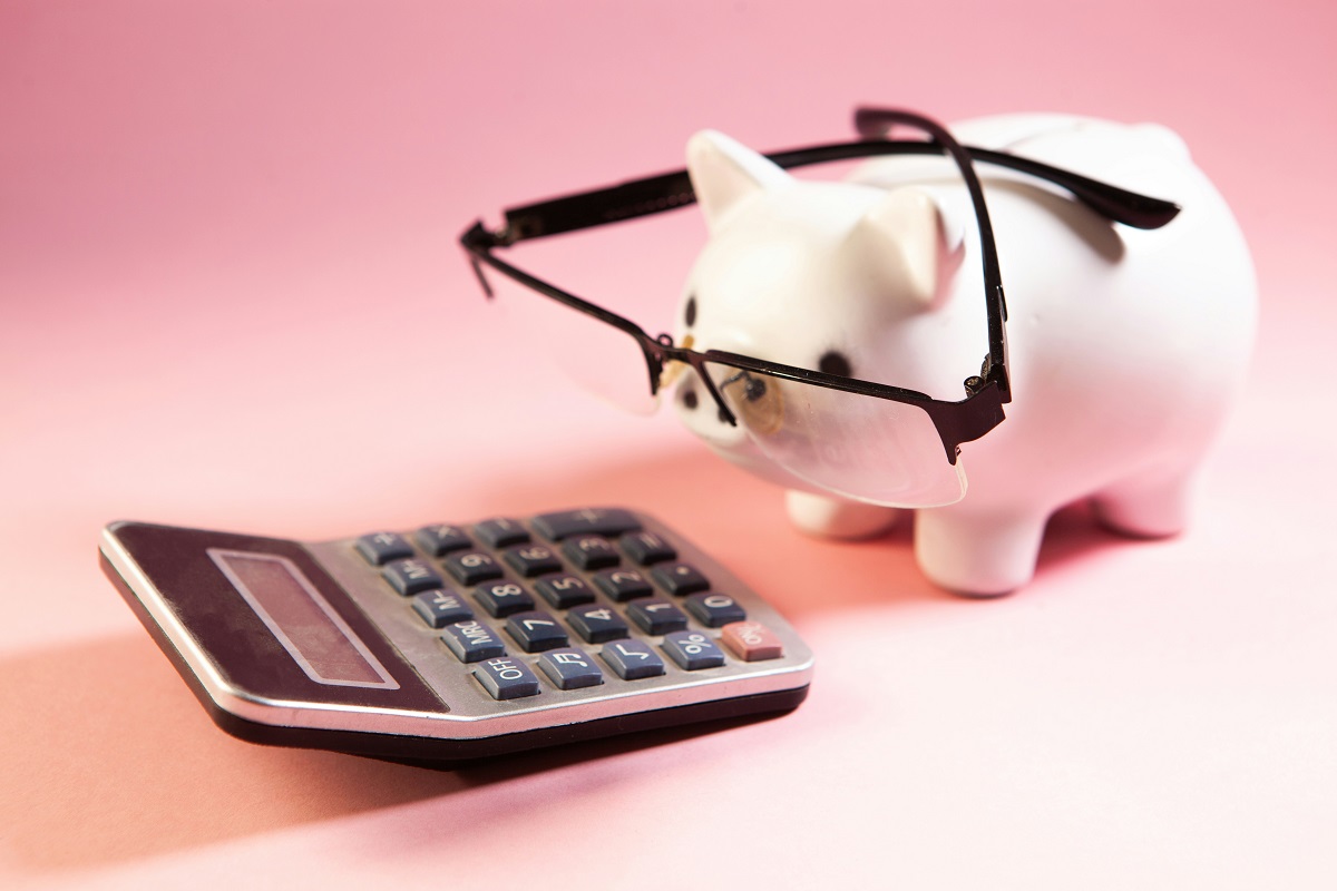 piggy bank wearing glasses and calculator
